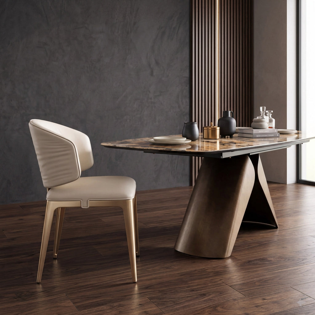 Side profile of the cream leather dining chair beside a stone-top dining table