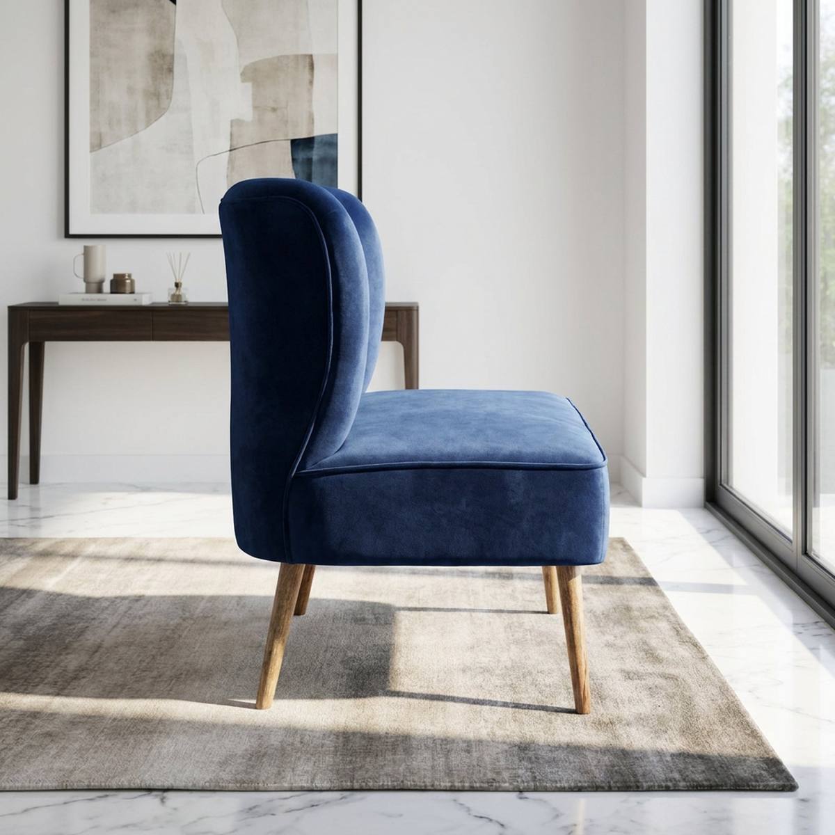 Navy velvet settee at the foot of a bed