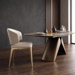 Side profile of the cream leather dining chair beside a stone-top dining table