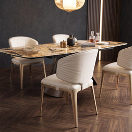 Rear view of the curved backrest of the cream leather dining chair