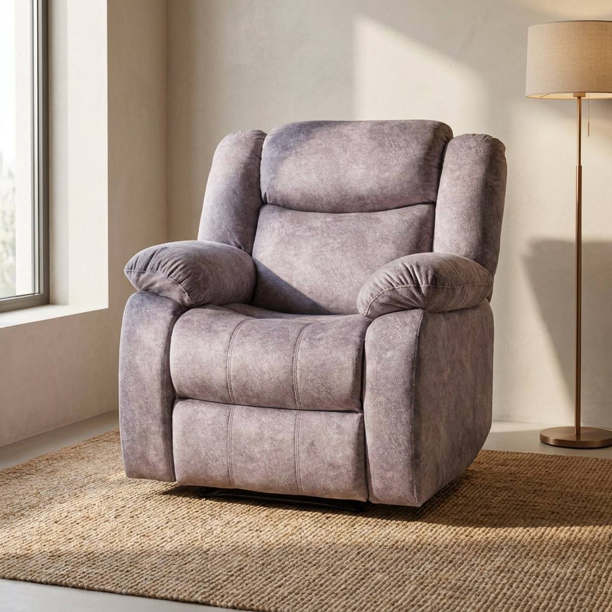 Light grey recliner armchair angled view