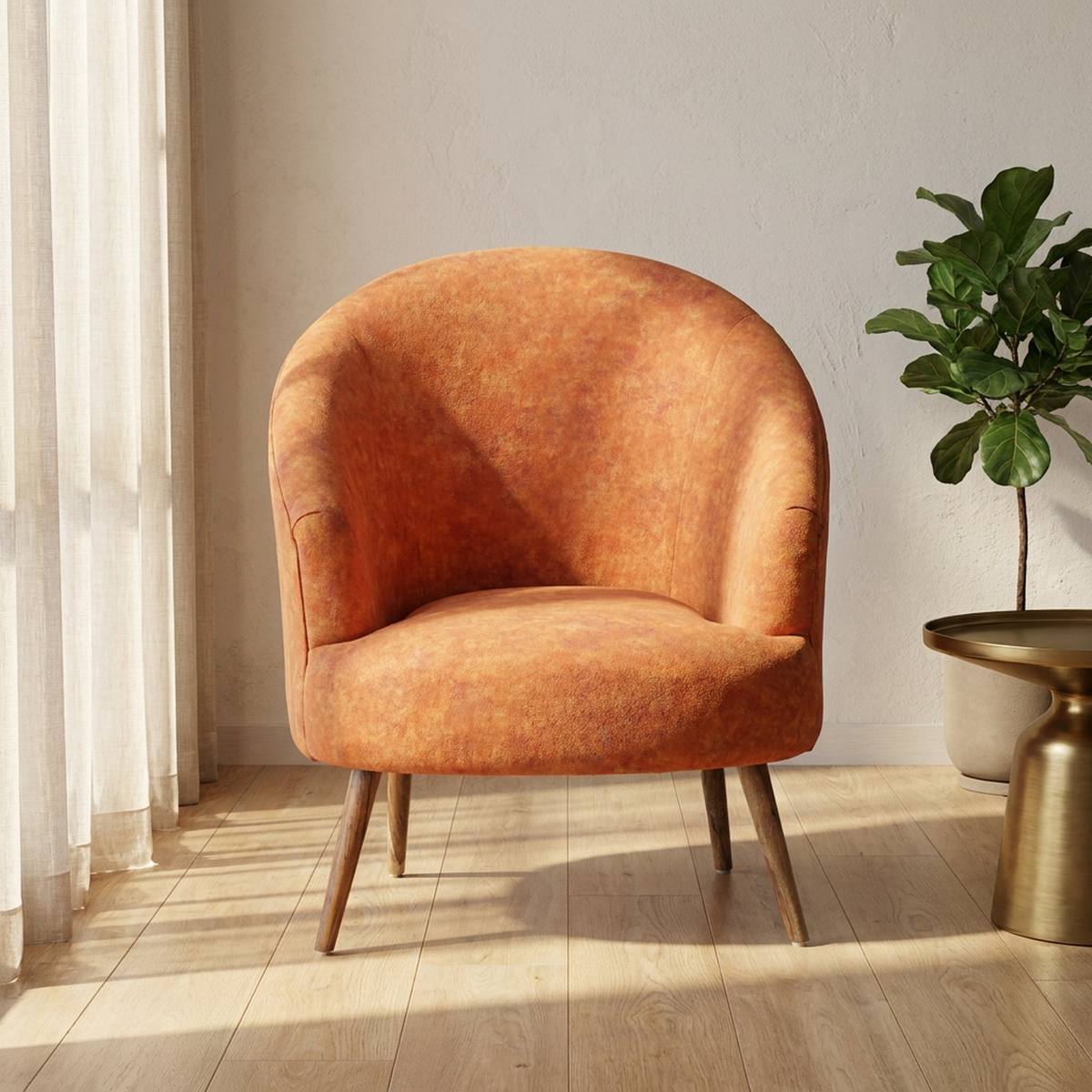 Rust orange barrel accent chair in a styled living room