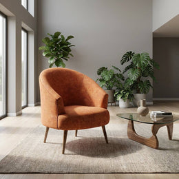 Rust orange accent chair near a window