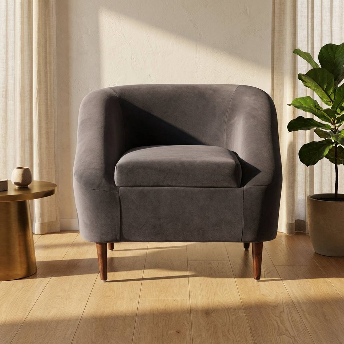 Charcoal grey velvet lounge chair in a modern living room