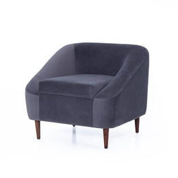 Charcoal grey velvet lounge chair angled studio shot
