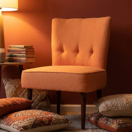 Orange slipper chair with side table