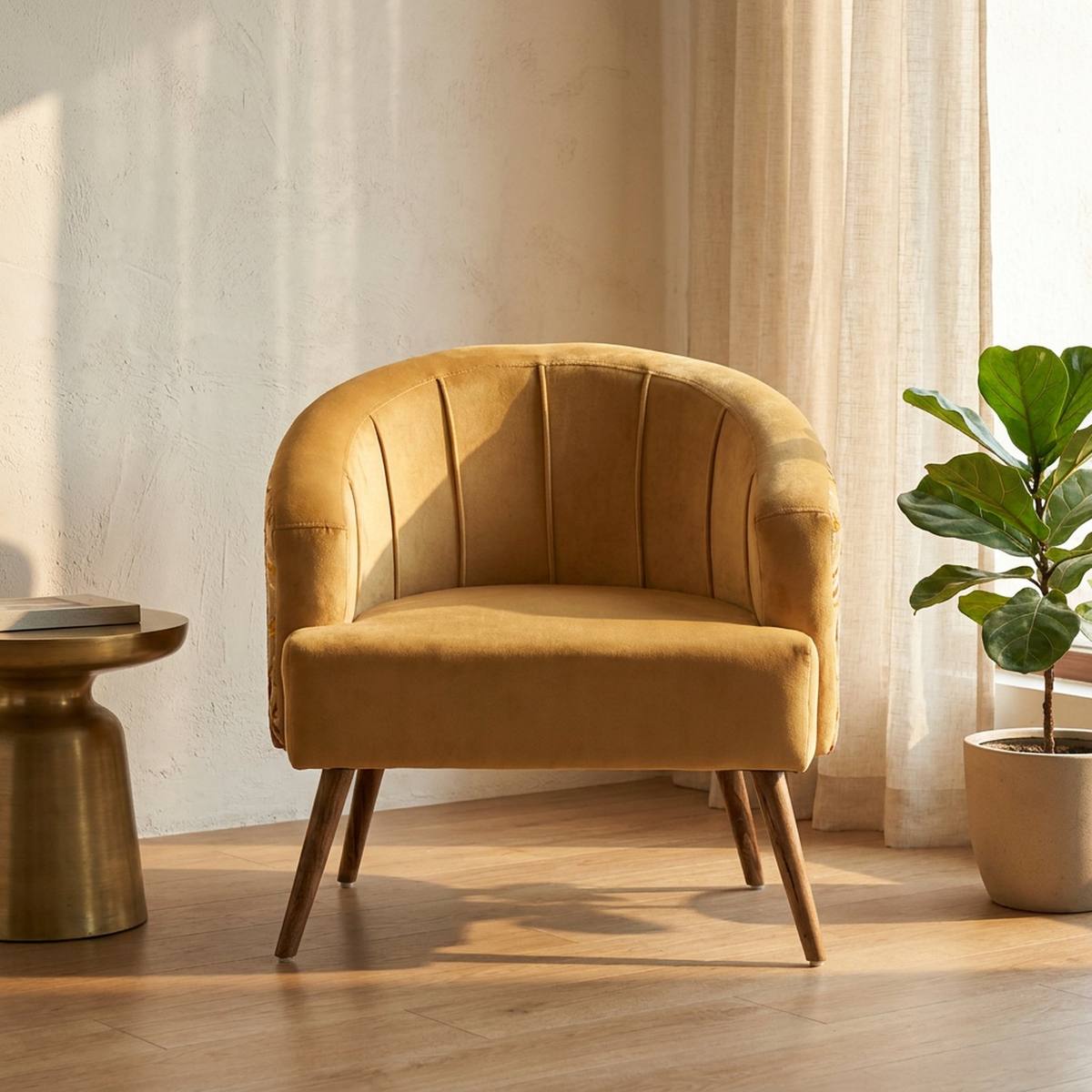 Mustard yellow velvet barrel accent chair in a living room