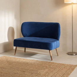 Navy velvet settee in an entryway