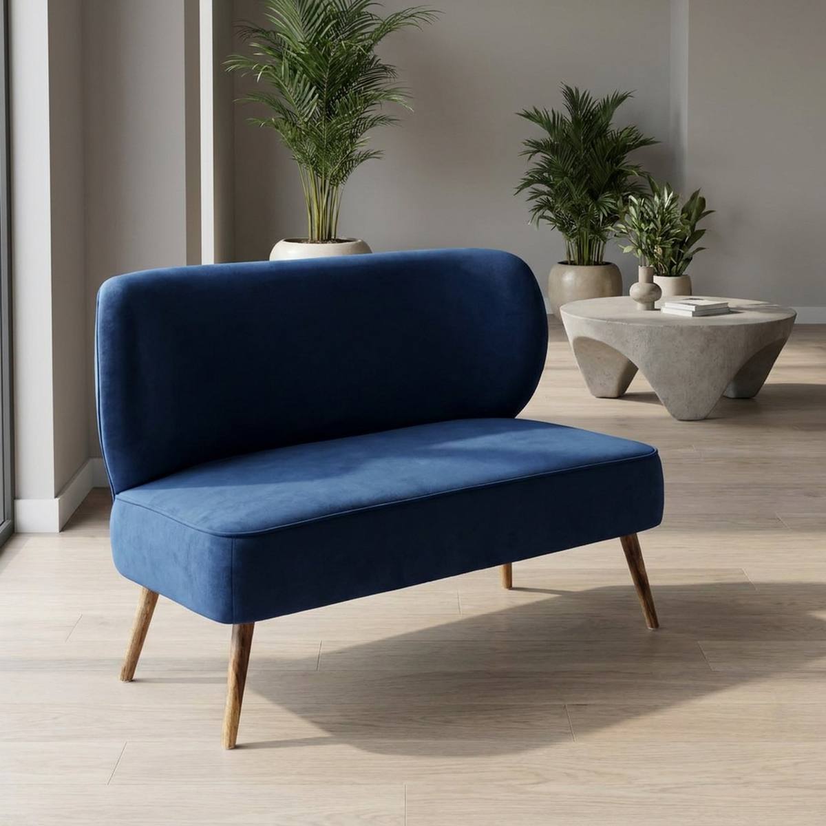 Navy velvet settee near a window