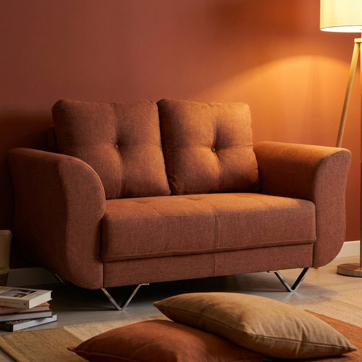 Rust brown 2 seater sofa with cushions and rug