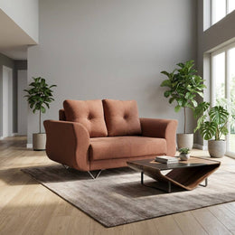 Rust brown 2 seater sofa near a window