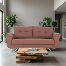 Rust brown 3 seater sofa near a window