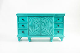 Turquoise carved sunburst sideboard front view on plain background